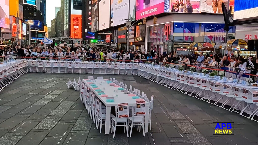 Thousands View Empty Shabbat Table in Times Square Set for the 224 Hostages